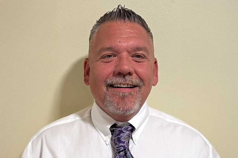 Ken Walker professional headshot in suit and tie